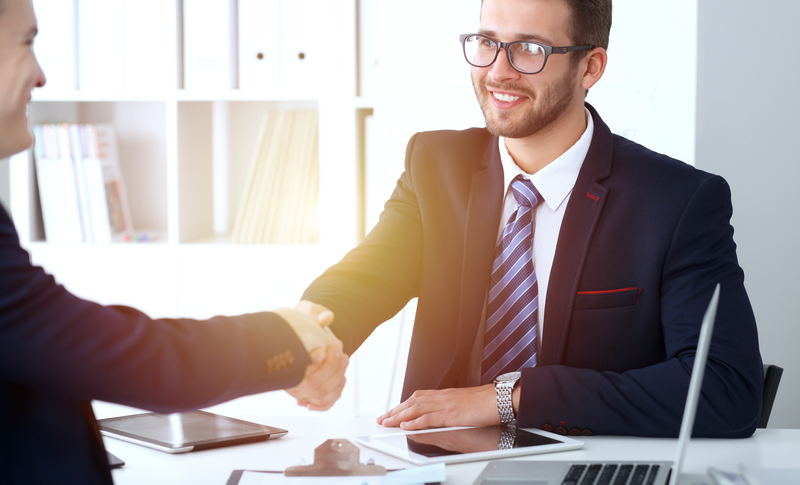 handshake between two men at job interview