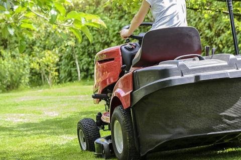 lawn care specialist mowing lawn