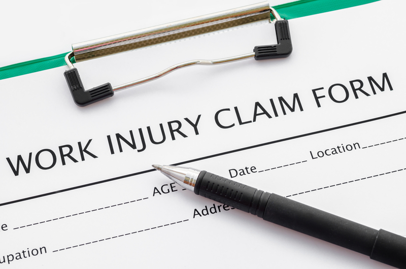 pen on work injury claim document